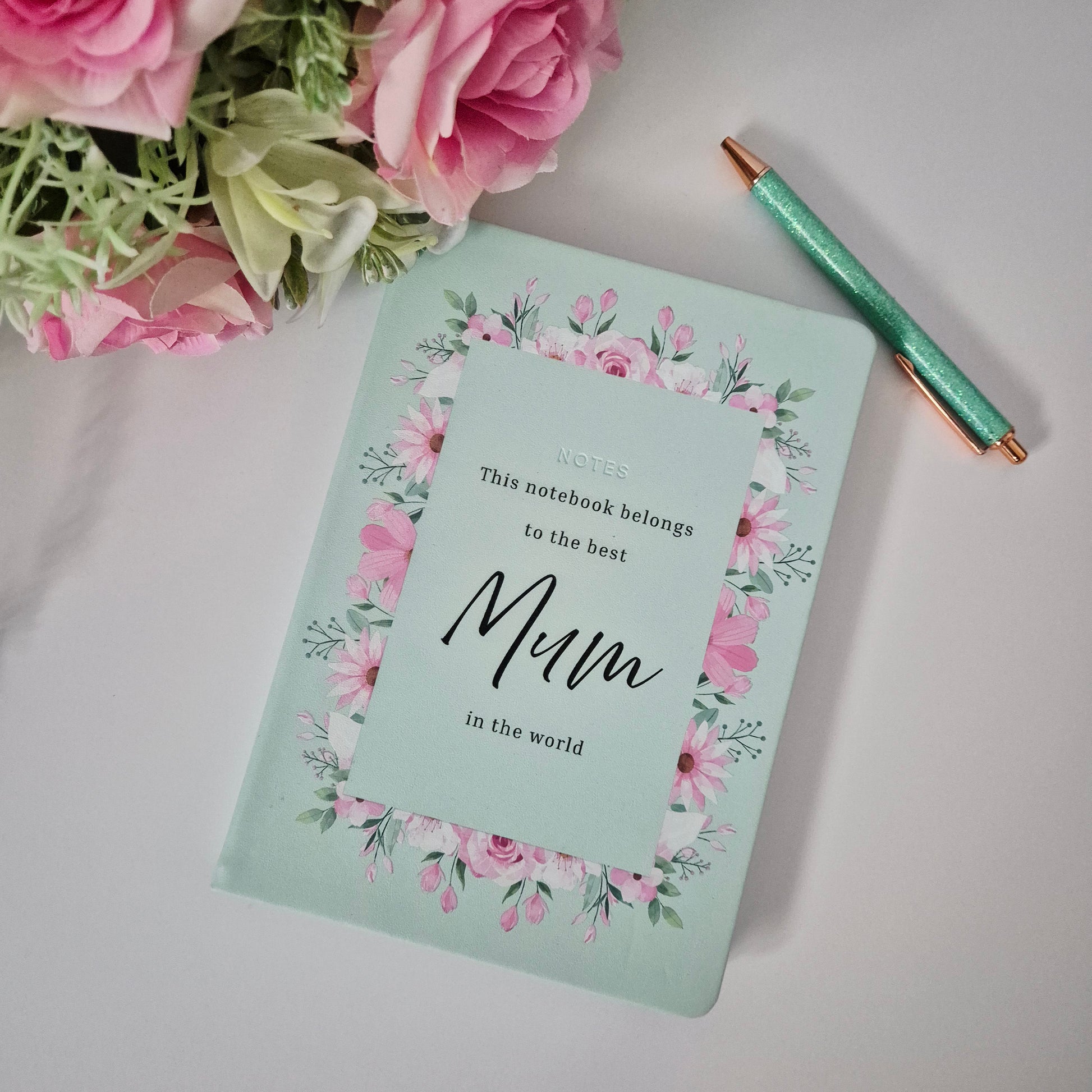 A personalised notebook for a special mum, nana, granny featuring a soft floral border and the words this notebook belongs to the best .... in the world. 