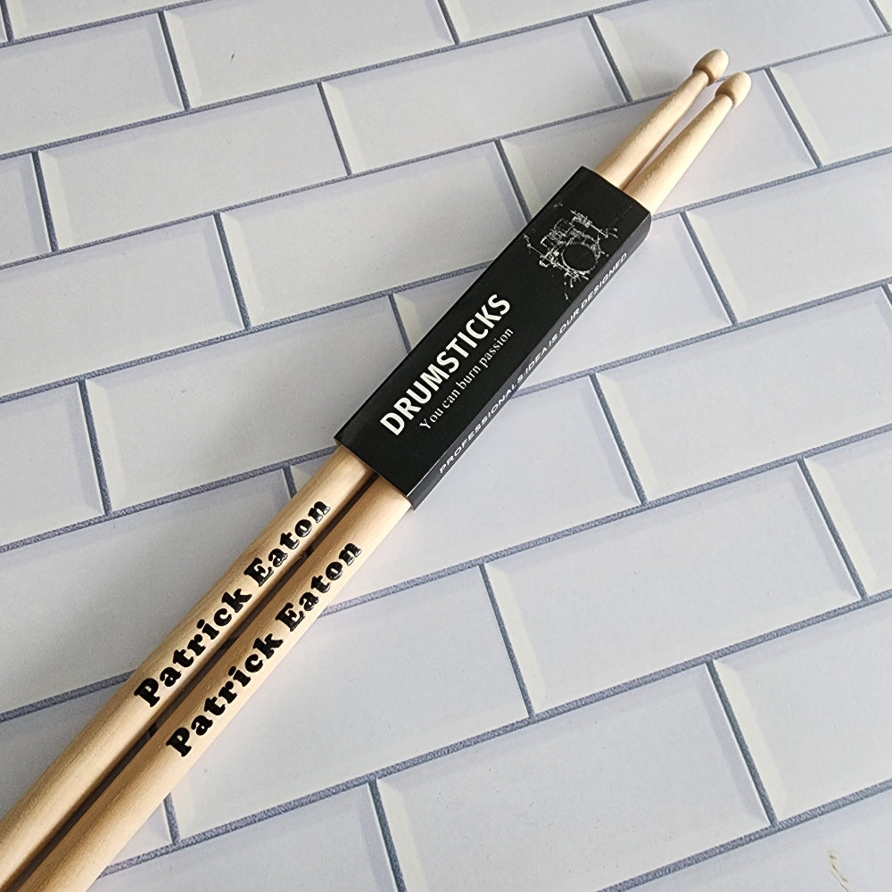 Custom printed drumsticks with a name on them