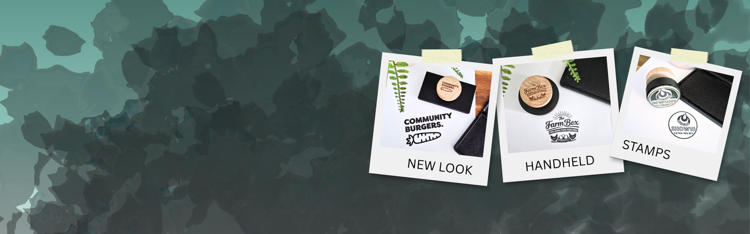 Three product packages labeled 'New Look', 'Handheld', and 'Stamps' on a textured green background.