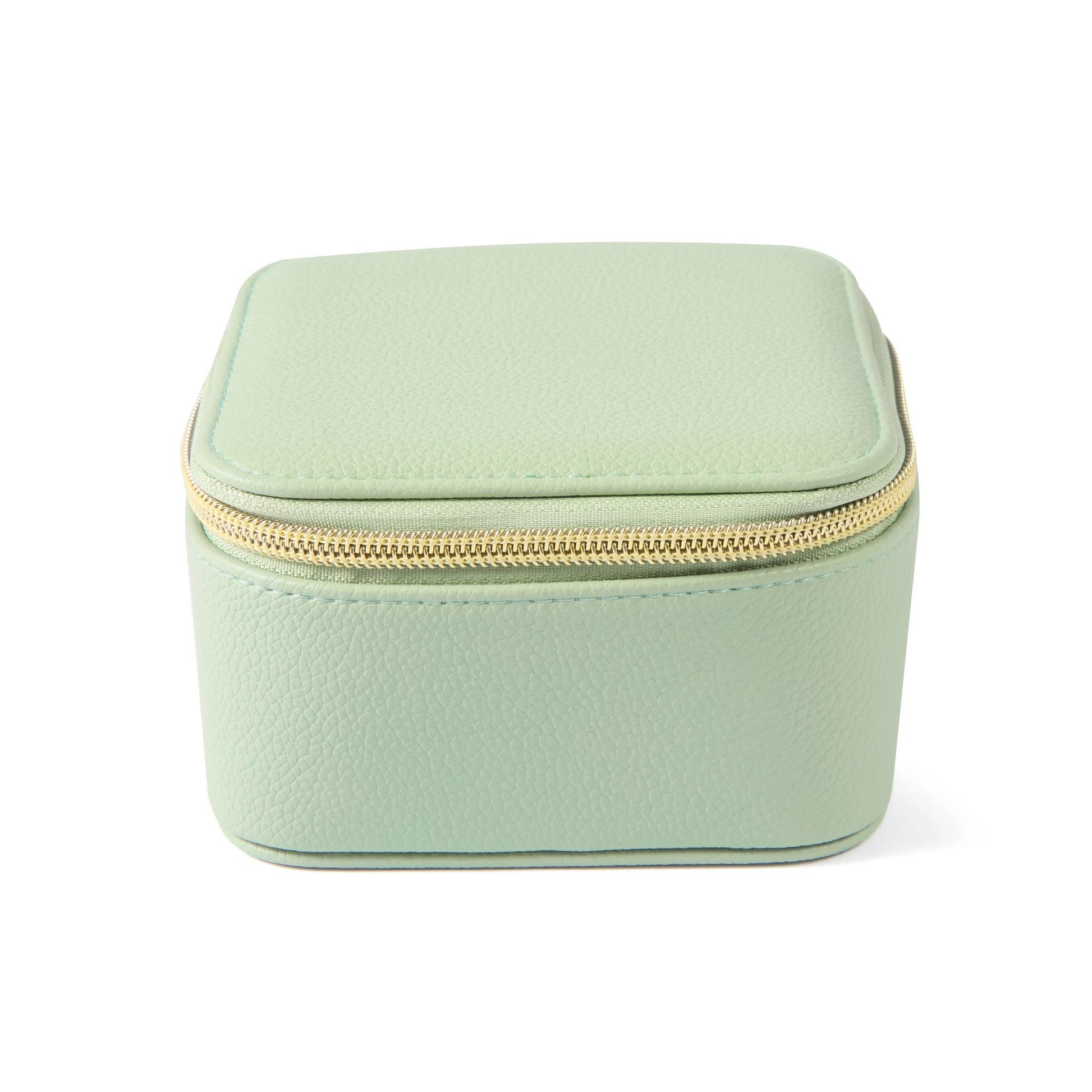 Mint green jewelry box with a gold zipper on a white background